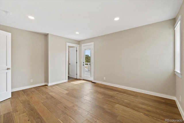 11840 Elkhorn Dr, Franktown, CO 80116 - unfurnished room featuring light wood-style floors, baseboards, and recessed lighting