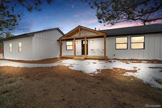 11840 Elkhorn Dr, Franktown, CO 80116 - modern farmhouse style home featuring covered porch, board and batten siding, and a shingled roof