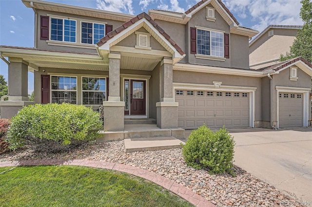 view of front of house with a garage and a porch