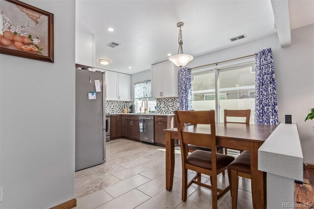 dining space featuring recessed lighting and visible vents