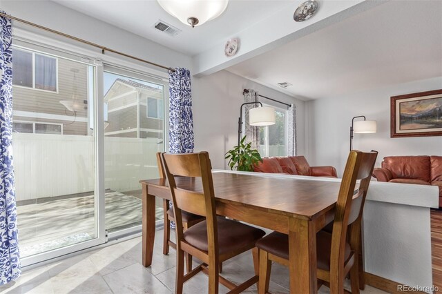 dining space featuring visible vents