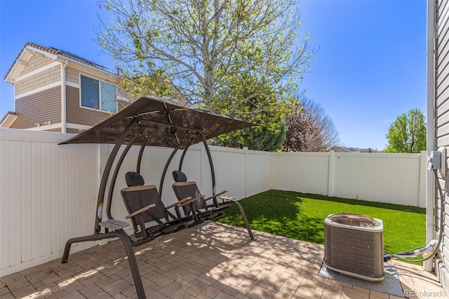 view of patio / terrace featuring a fenced backyard and central AC unit