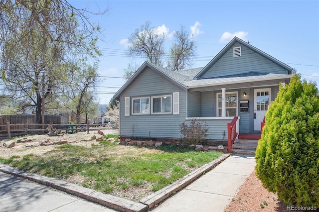 112 S Limit St, Colorado Springs, CO 80905 - bungalow featuring roof with shingles, fence, and covered porch