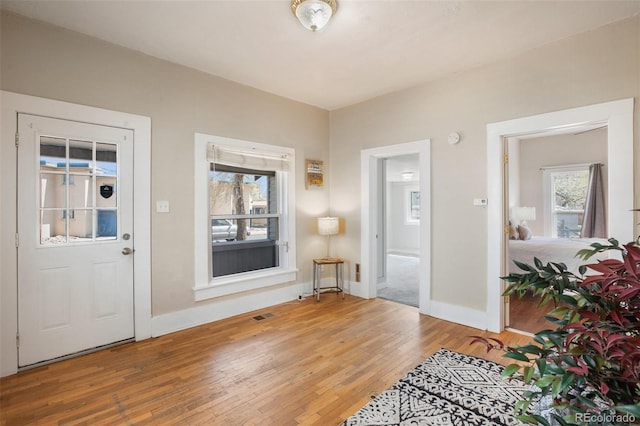 112 S Limit St, Colorado Springs, CO 80905 - foyer entrance with hardwood / wood-style floors, baseboards, and visible vents