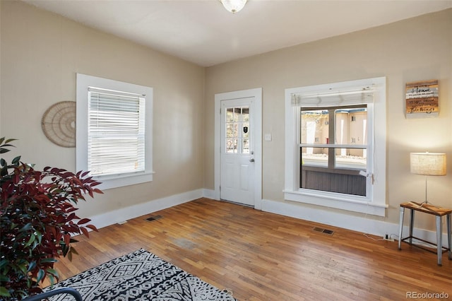 112 S Limit St, Colorado Springs, CO 80905 - foyer with visible vents, baseboards, and wood finished floors