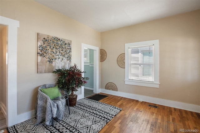 112 S Limit St, Colorado Springs, CO 80905 - living area with hardwood / wood-style flooring, baseboards, and visible vents