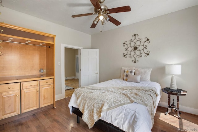 112 S Limit St, Colorado Springs, CO 80905 - bedroom with ceiling fan, baseboards, and dark wood-style floors