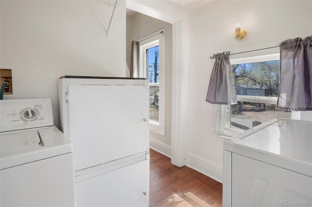 112 S Limit St, Colorado Springs, CO 80905 - clothes washing area featuring light wood-style floors, washer / dryer, and laundry area