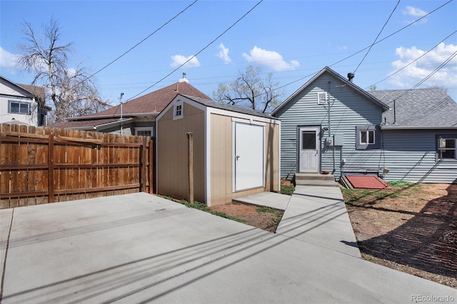 112 S Limit St, Colorado Springs, CO 80905 - view of front of property with entry steps, a storage unit, fence, and an outdoor structure