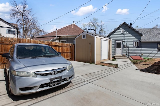 112 S Limit St, Colorado Springs, CO 80905 - view of front of house with fence, an outbuilding, and a storage unit