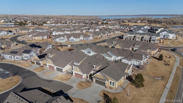 birds eye view of property with a residential view