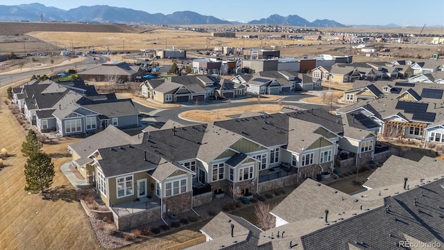 birds eye view of property featuring a mountain view and a residential view