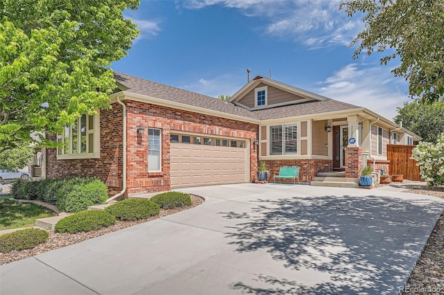 20058 E Dartmouth Dr, Aurora, CO 80013 - view of front of home with brick siding, a garage, concrete driveway, and roof with shingles