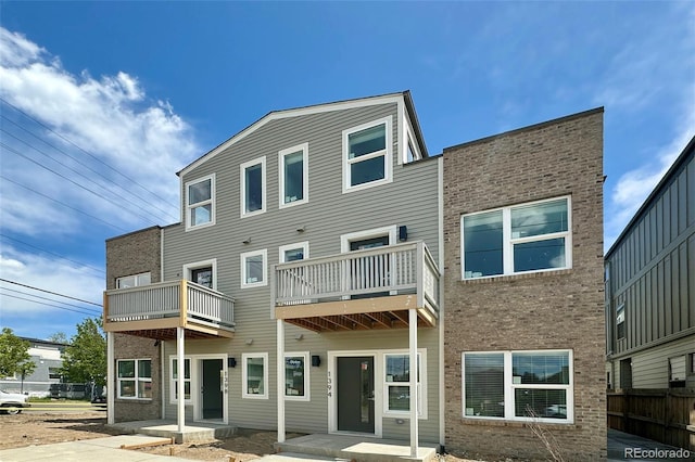 rear view of property with a balcony