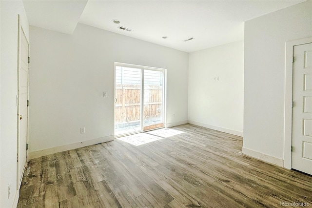 empty room featuring hardwood / wood-style floors