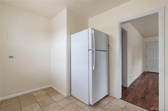 kitchen featuring light hardwood / wood-style floors and white fridge