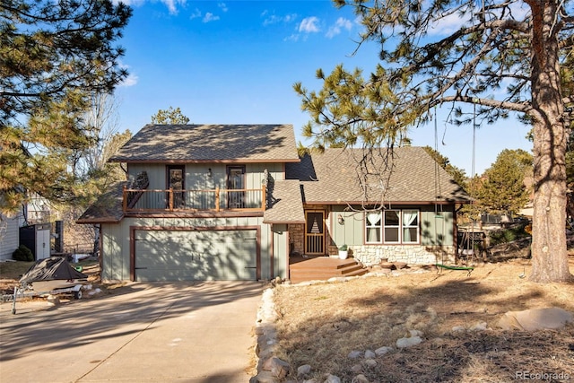 view of front of home with a balcony and a garage