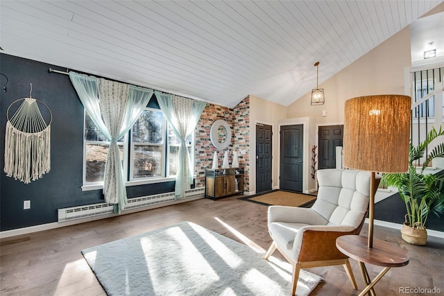 living area featuring lofted ceiling, hardwood / wood-style flooring, baseboard heating, and wooden ceiling