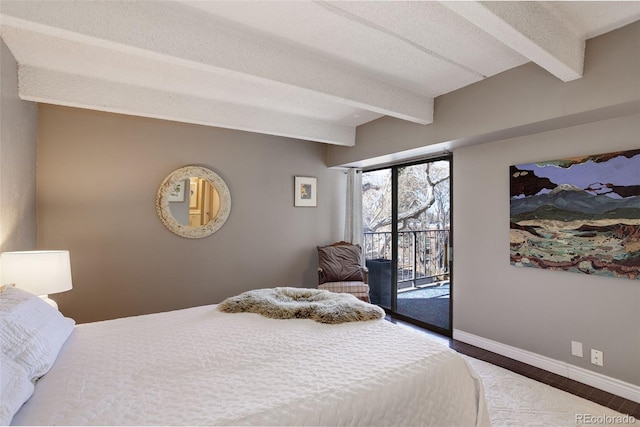 bedroom featuring wood finished floors, access to outside, baseboards, and beamed ceiling