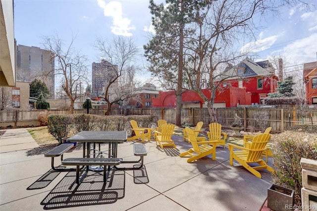 view of patio featuring outdoor dining space and a fenced backyard