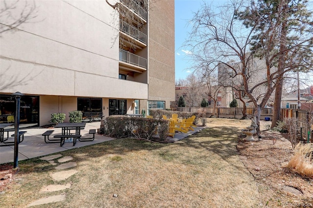 exterior space with a patio and fence