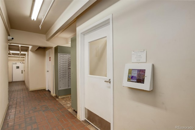 hallway featuring brick floor