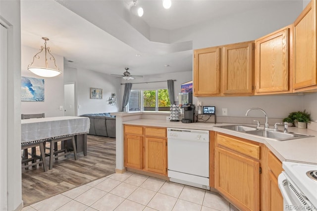 kitchen with light brown cabinetry, sink, hanging light fixtures, light tile patterned floors, and white appliances