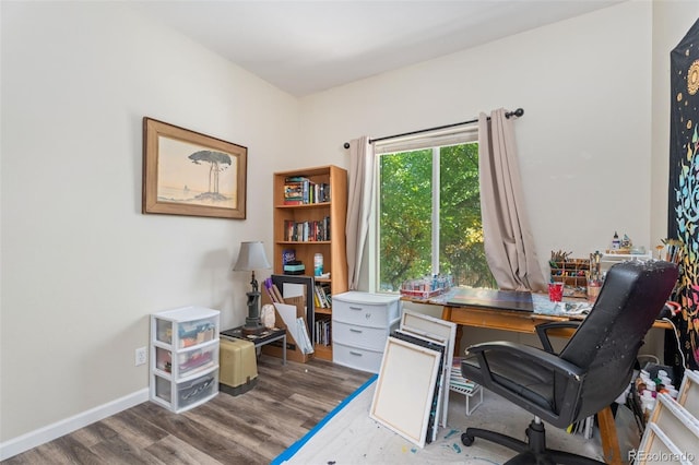 home office with hardwood / wood-style floors