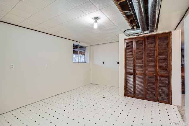 basement featuring light floors