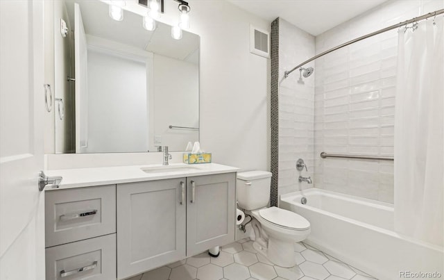 full bathroom with shower / bath combination with curtain, vanity, toilet, and tile patterned floors