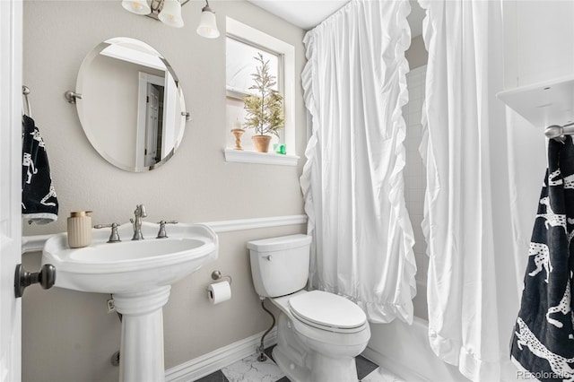 20740 Parker Vista Rd, Parker, CO 80138 - bathroom with shower / tub combo with curtain and marble finish flooring