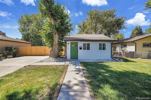 single story home with a front yard