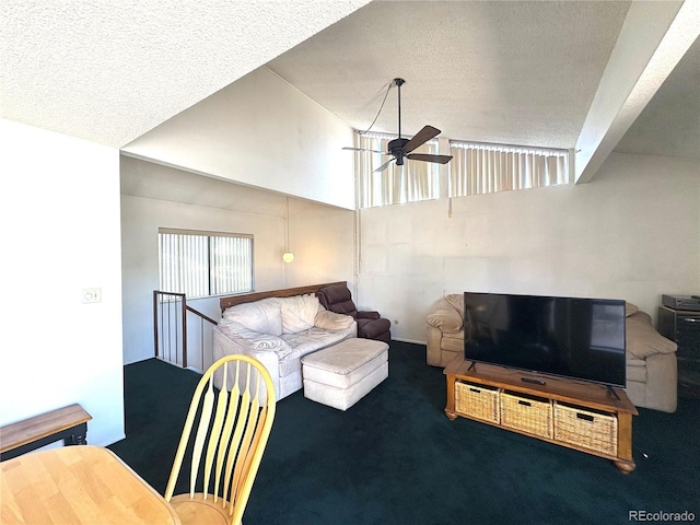 living area featuring carpet floors, a ceiling fan, a textured ceiling, and high vaulted ceiling