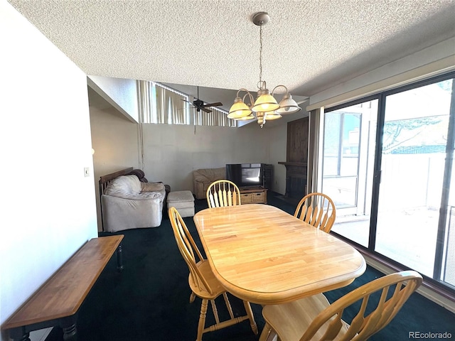dining space with an inviting chandelier, carpet flooring, and a textured ceiling