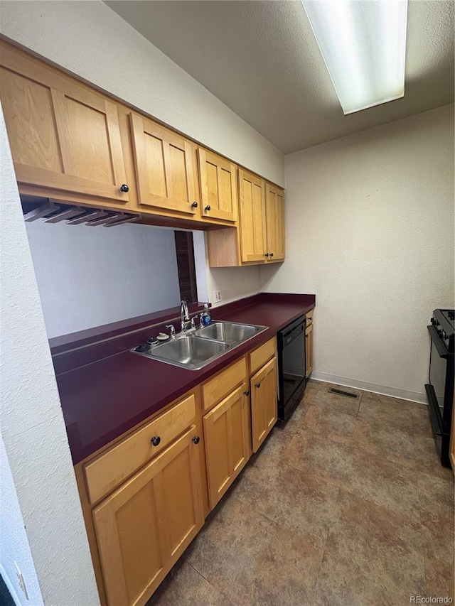 kitchen featuring visible vents, dark countertops, a sink, black appliances, and dark floors