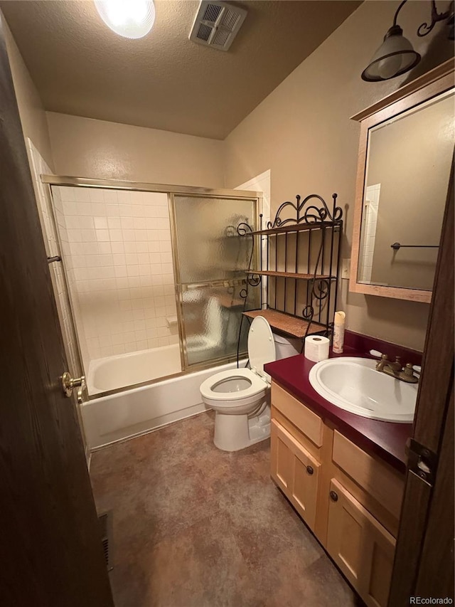 full bathroom featuring visible vents, vanity, toilet, a textured ceiling, and enclosed tub / shower combo