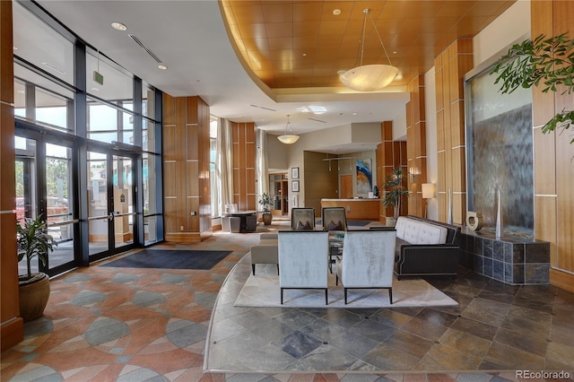8100 E Union Ave Unit 1502, Denver, CO 80237 - building lobby with a towering ceiling, expansive windows, and recessed lighting