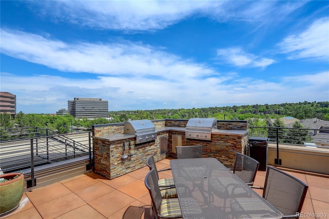 8100 E Union Ave Unit 1502, Denver, CO 80237 - view of patio with outdoor dining space and a balcony