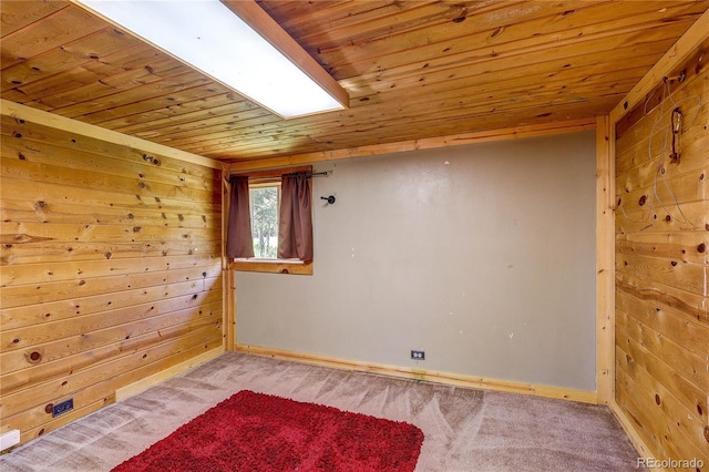 10893 Milliken Ave, Conifer, CO 80433 - unfurnished room featuring wood ceiling, light carpet, and wooden walls
