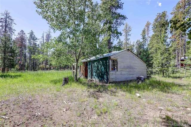 10893 Milliken Ave, Conifer, CO 80433 - view of yard featuring an outbuilding