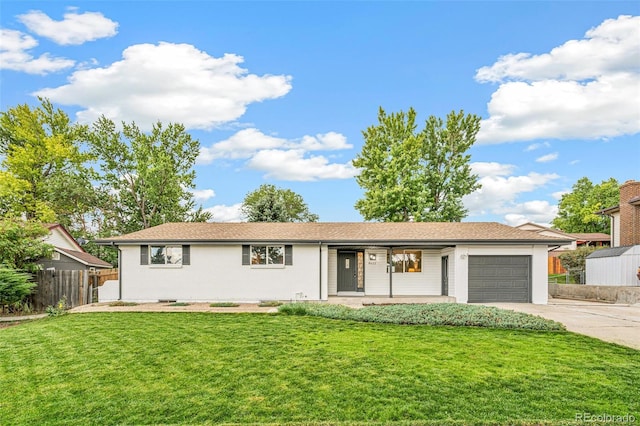 single story home featuring a garage and a front yard