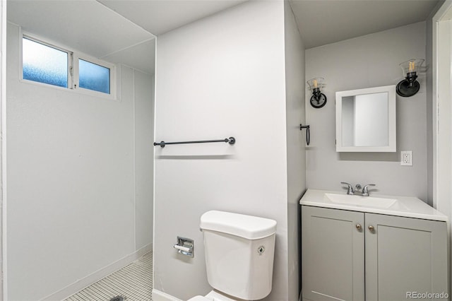 bathroom featuring a shower, tile patterned flooring, toilet, and vanity