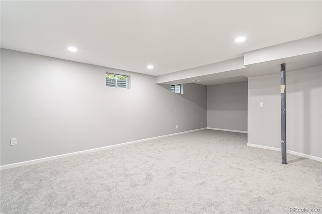 basement with light colored carpet