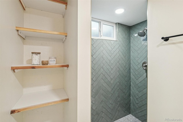 bathroom with tiled shower