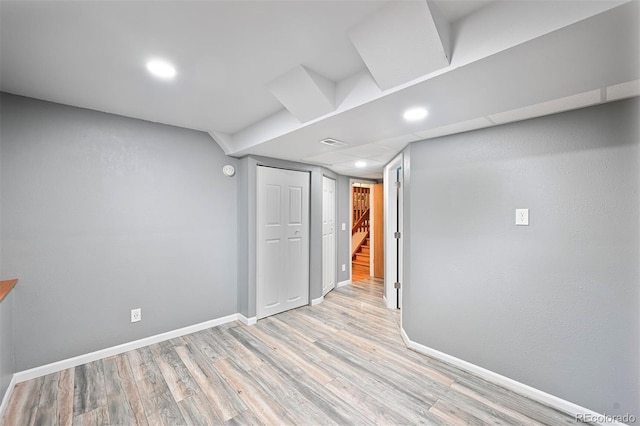 5602 S Yank Ct, Littleton, CO 80127 - finished basement featuring light wood-style flooring, recessed lighting, and stairway