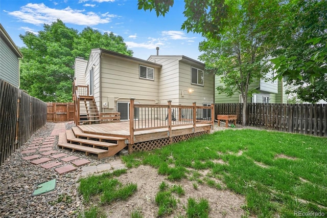 5602 S Yank Ct, Littleton, CO 80127 - rear view of house featuring a fenced backyard and a wooden deck