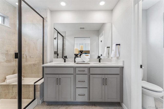 2110 Wagon Wheel Aly, Brighton, CO 80601 - bathroom with a stall shower, double vanity, recessed lighting, and connected bathroom
