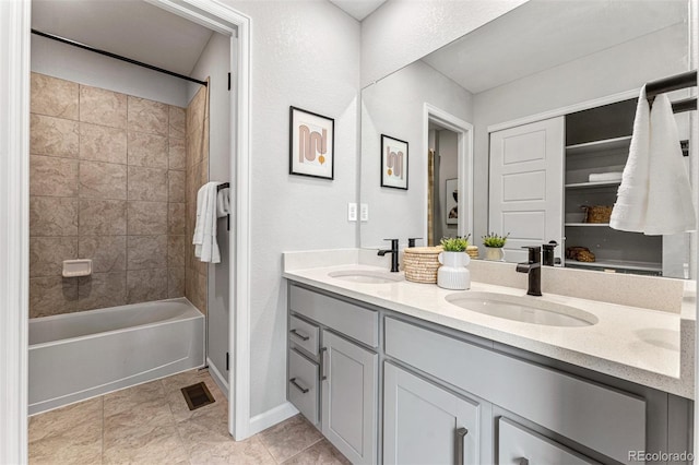 2110 Wagon Wheel Aly, Brighton, CO 80601 - bathroom with double vanity and washtub / shower combination