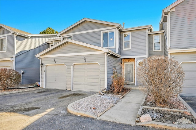 multi unit property featuring a garage