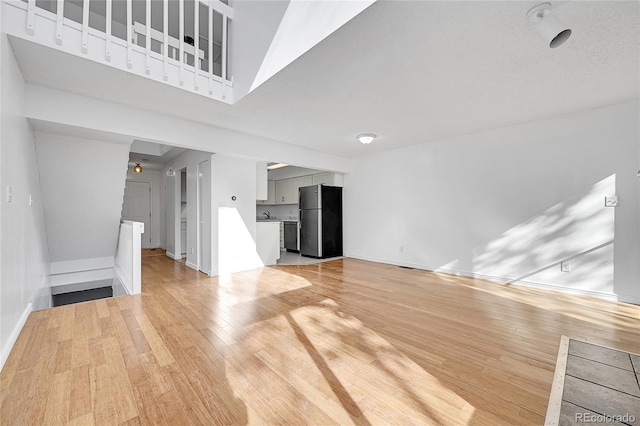 unfurnished living room featuring light hardwood / wood-style floors